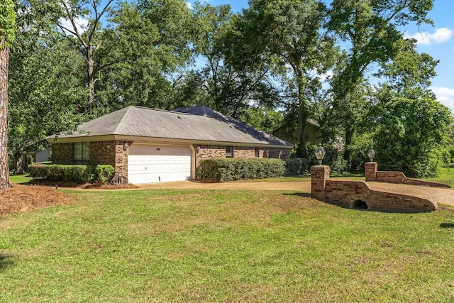 4601 Killimore Ln, Tallahassee, FL 32309 - view of side of property featuring a yard, an attached garage, brick siding, and driveway