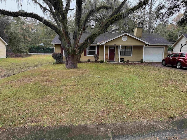 ranch-style house with a garage and a front yard