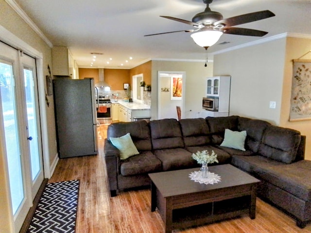 88 Wildwood Dr, Crawfordville, FL 32327 - living area with light wood finished floors, ornamental molding, and ceiling fan