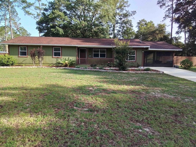 88 Wildwood Dr, Crawfordville, FL 32327 - ranch-style home featuring driveway, a carport, and covered porch