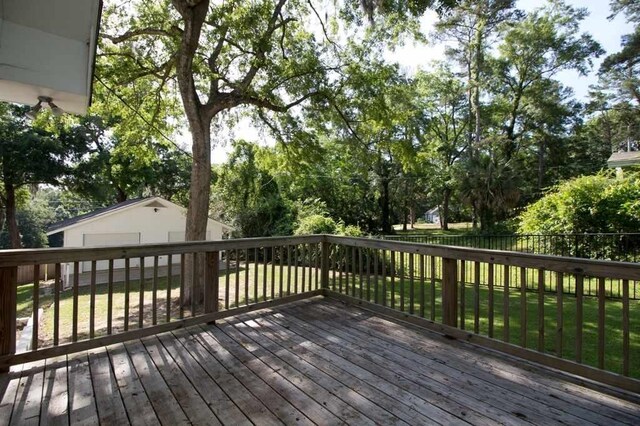 wooden deck with a yard