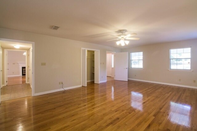 interior space with hardwood / wood-style floors and ceiling fan