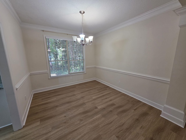 9369 Buck Haven Trl, Tallahassee, FL 32312 - unfurnished dining area featuring a chandelier, ornamental molding, wood finished floors, and a textured ceiling