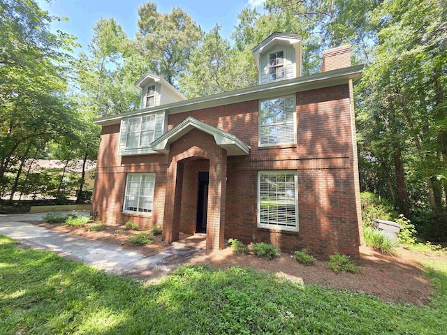 9369 Buck Haven Trl, Tallahassee, FL 32312 - view of front of house with brick siding and a chimney