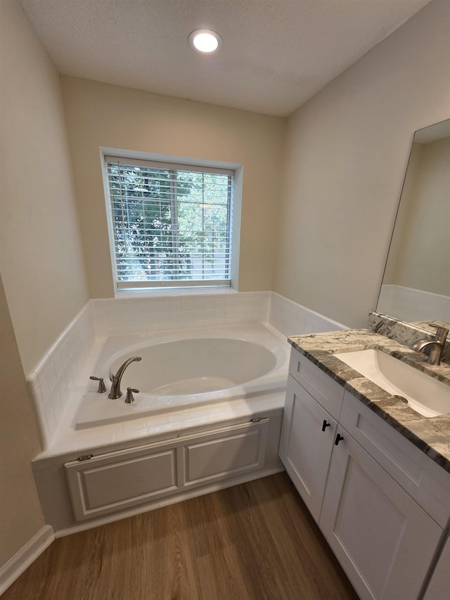 9369 Buck Haven Trl, Tallahassee, FL 32312 - full bathroom with vanity, a bath, wood finished floors, and recessed lighting