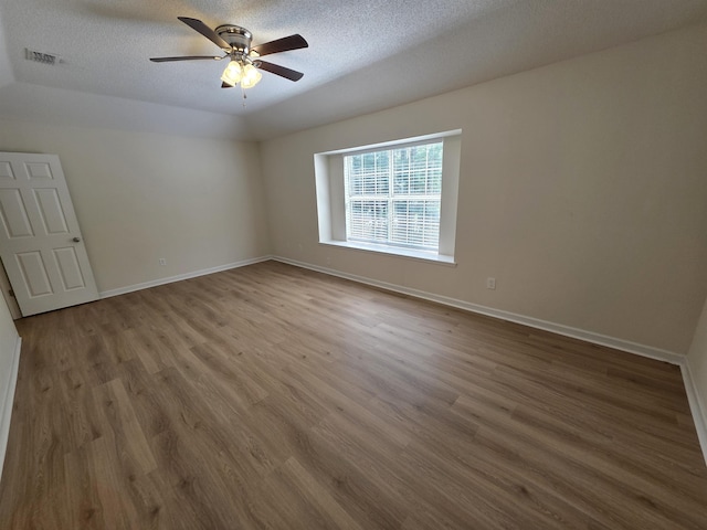 9369 Buck Haven Trl, Tallahassee, FL 32312 - unfurnished room with wood finished floors, ceiling fan, and a textured ceiling