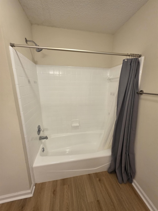 9369 Buck Haven Trl, Tallahassee, FL 32312 - full bath with wood finished floors, shower / bath combination with curtain, and a textured ceiling
