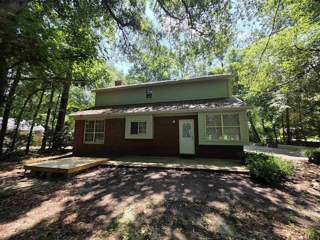 9369 Buck Haven Trl, Tallahassee, FL 32312 - view of front of home with a chimney and a deck