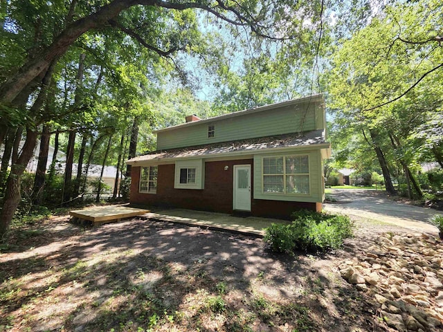 9369 Buck Haven Trl, Tallahassee, FL 32312 - view of front facade featuring a chimney and brick siding