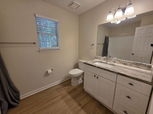 9369 Buck Haven Trl, Tallahassee, FL 32312 - full bathroom with wood finished floors, vanity, and a shower with curtain