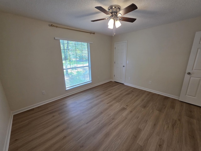 9369 Buck Haven Trl, Tallahassee, FL 32312 - empty room featuring wood finished floors, a ceiling fan, and a textured ceiling