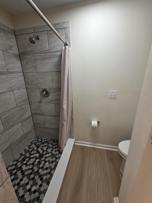 9369 Buck Haven Trl, Tallahassee, FL 32312 - bathroom with wood finished floors and a tile shower