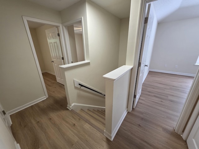 9369 Buck Haven Trl, Tallahassee, FL 32312 - corridor featuring an upstairs landing and wood finished floors