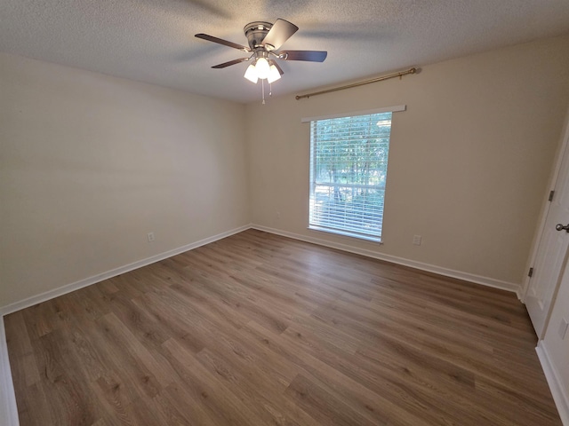 9369 Buck Haven Trl, Tallahassee, FL 32312 - spare room with wood finished floors, a textured ceiling, and ceiling fan