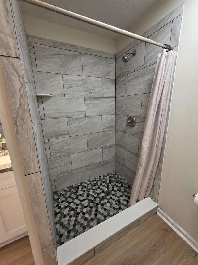 9369 Buck Haven Trl, Tallahassee, FL 32312 - full bath with a tile shower, wood finished floors, and vanity