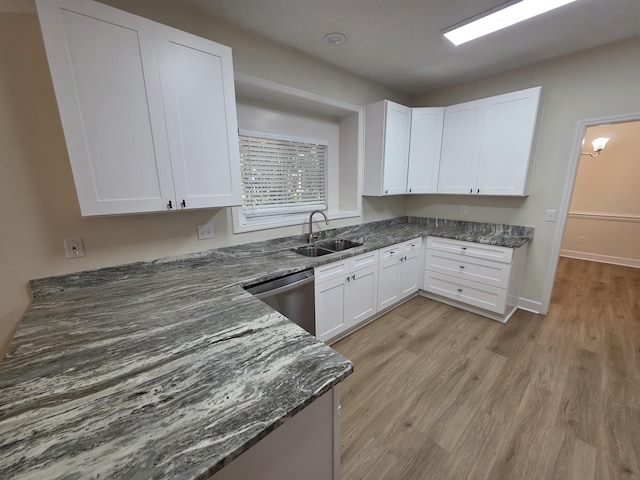 9369 Buck Haven Trl, Tallahassee, FL 32312 - kitchen featuring stainless steel dishwasher, dark stone countertops, white cabinetry, and light wood-style flooring