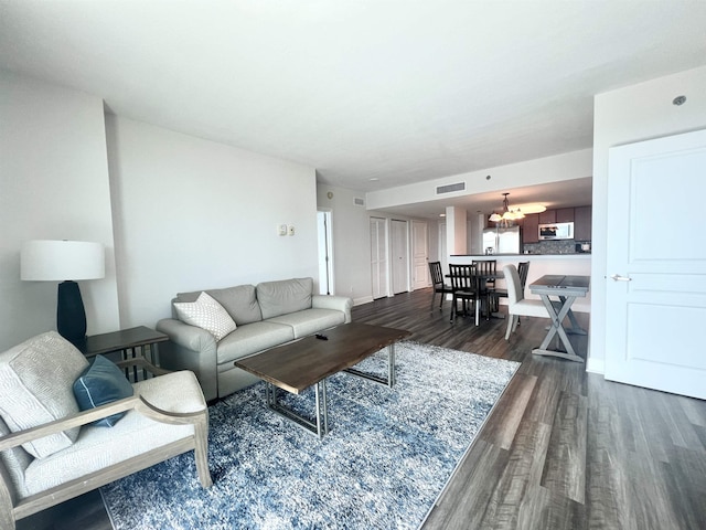 300 S Duval St Unit 1602, Tallahassee, FL 32301 - living room with dark wood-style floors and a chandelier