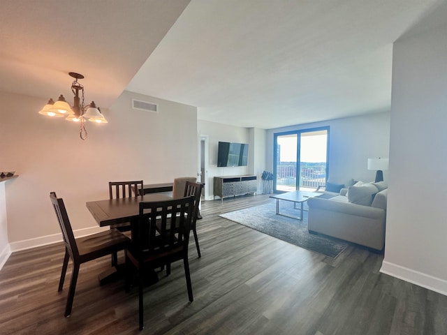 300 S Duval St Unit 1602, Tallahassee, FL 32301 - dining room with dark wood-style flooring and a chandelier