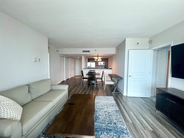 300 S Duval St Unit 1602, Tallahassee, FL 32301 - living area featuring a chandelier and dark wood finished floors