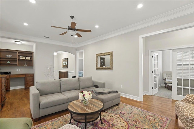 2617 Manassas Way, Tallahassee, FL 32312 - living area with ceiling fan, wood finished floors, recessed lighting, arched walkways, and crown molding
