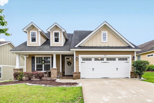 2617 Manassas Way, Tallahassee, FL 32312 - craftsman-style house with concrete driveway, board and batten siding, a porch, a front lawn, and roof with shingles