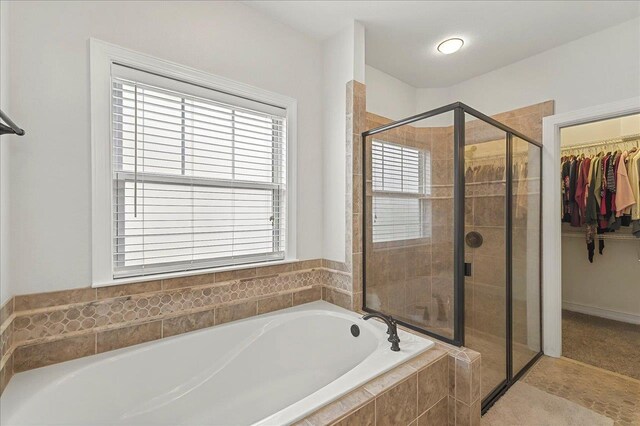 2617 Manassas Way, Tallahassee, FL 32312 - bathroom with a bath, a stall shower, and a spacious closet