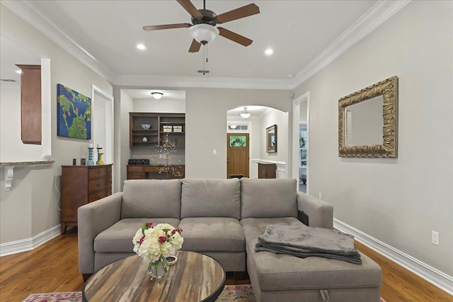 2617 Manassas Way, Tallahassee, FL 32312 - living area with a ceiling fan, arched walkways, wood finished floors, crown molding, and recessed lighting