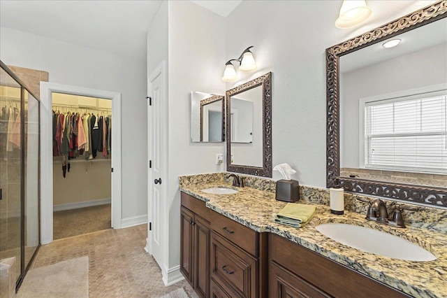 2617 Manassas Way, Tallahassee, FL 32312 - full bathroom featuring a shower stall, double vanity, and a spacious closet