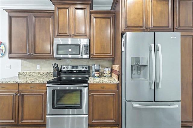 2617 Manassas Way, Tallahassee, FL 32312 - kitchen with stainless steel appliances, tasteful backsplash, and light stone countertops
