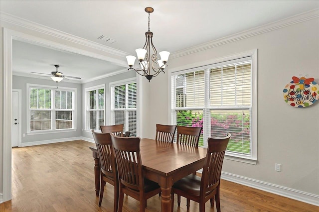 2617 Manassas Way, Tallahassee, FL 32312 - dining space featuring a chandelier, plenty of natural light, crown molding, wood finished floors, and ceiling fan