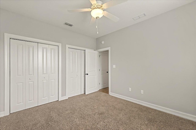 2617 Manassas Way, Tallahassee, FL 32312 - unfurnished bedroom featuring carpet floors, multiple closets, and ceiling fan