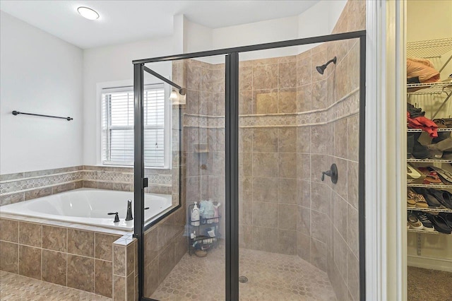 2617 Manassas Way, Tallahassee, FL 32312 - bathroom featuring a garden tub, a walk in closet, and a stall shower