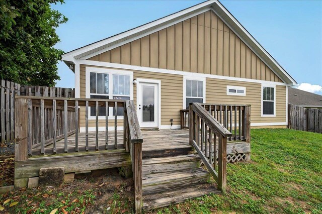 2617 Manassas Way, Tallahassee, FL 32312 - rear view of house featuring board and batten siding and a wooden deck