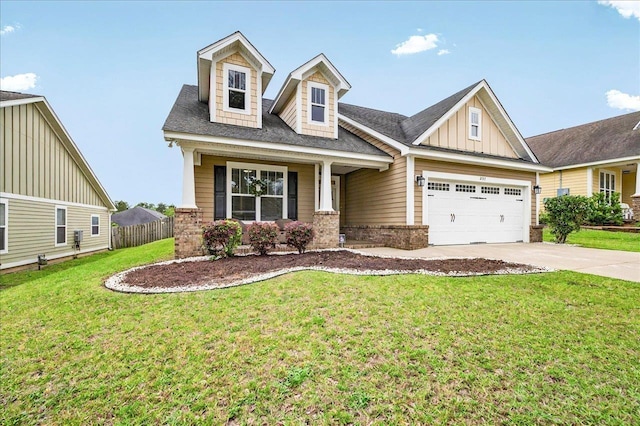 2617 Manassas Way, Tallahassee, FL 32312 - view of front of house featuring driveway, board and batten siding, brick siding, an attached garage, and roof with shingles