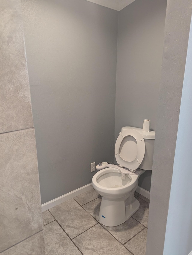 bathroom with tile patterned floors and toilet