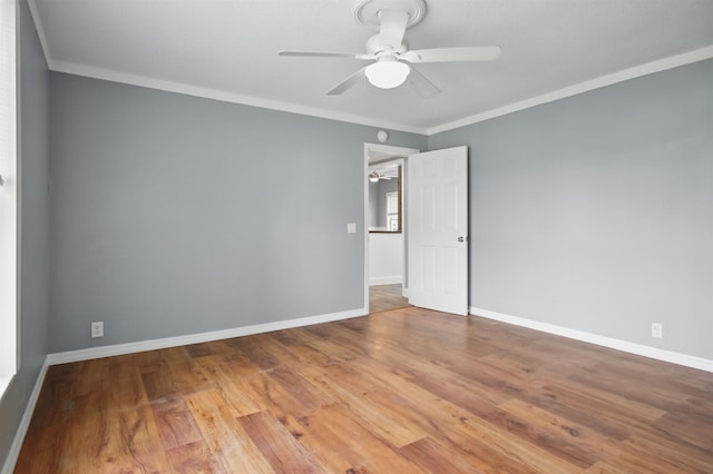 802 N Quincy St, Perry, FL 32347 - unfurnished room with a ceiling fan, ornamental molding, baseboards, and wood finished floors