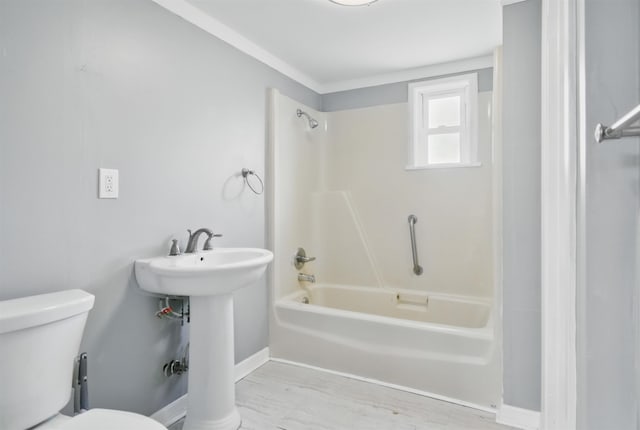 802 N Quincy St, Perry, FL 32347 - bathroom featuring toilet, shower / tub combination, baseboards, and a sink