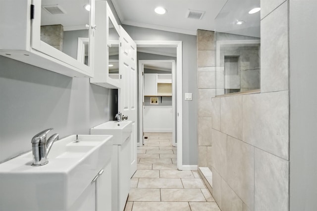 802 N Quincy St, Perry, FL 32347 - bathroom with a walk in shower, tile patterned flooring, crown molding, recessed lighting, and two vanities