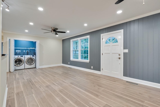 entrance foyer featuring visible vents, washer and clothes dryer, crown molding, light wood finished floors, and ceiling fan