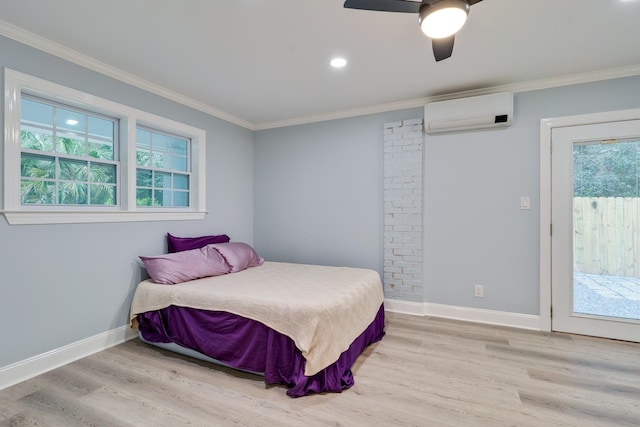 bedroom featuring light wood-style flooring, crown molding, and a wall mounted AC