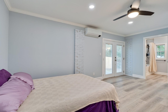 bedroom with a wall mounted AC, light wood-style flooring, french doors, crown molding, and access to outside