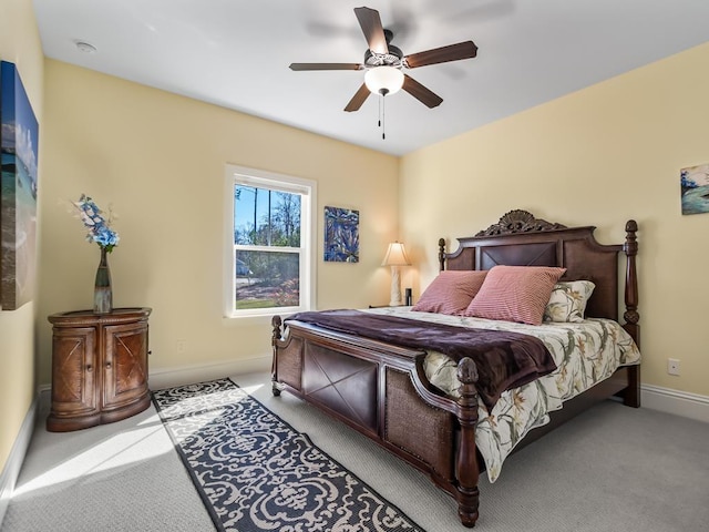 bedroom featuring ceiling fan and light colored carpet