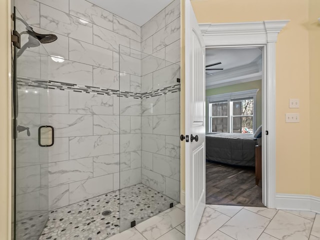 bathroom with crown molding and a shower with shower door