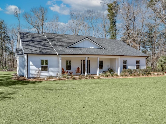 view of front of property with covered porch and a front yard