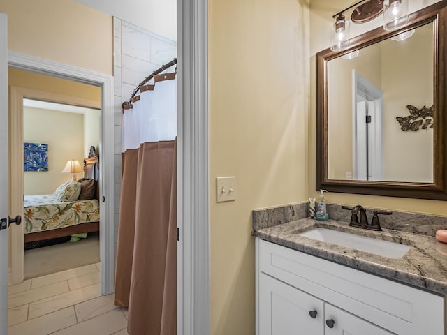 bathroom with a shower with shower curtain and vanity