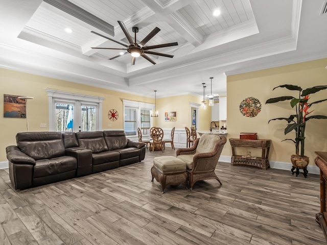 living room featuring hardwood / wood-style flooring, ornamental molding, beam ceiling, and coffered ceiling