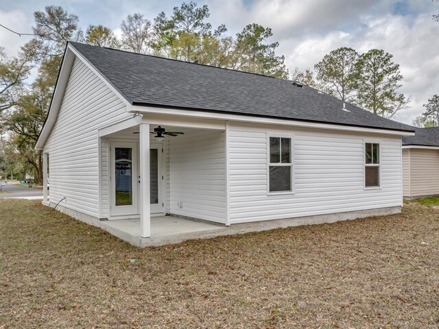 17 Broken Bow Trl, Crawfordville, FL 32327 - back of house featuring ceiling fan, roof with shingles, a patio, and a yard