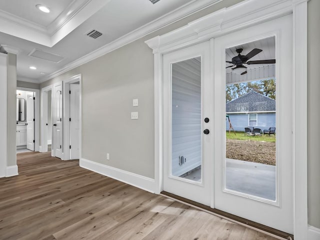 17 Broken Bow Trl, Crawfordville, FL 32327 - doorway to outside featuring crown molding, ceiling fan, wood finished floors, and baseboards