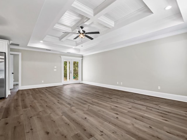 17 Broken Bow Trl, Crawfordville, FL 32327 - unfurnished living room featuring french doors, a tray ceiling, ornamental molding, dark wood-style floors, and baseboards