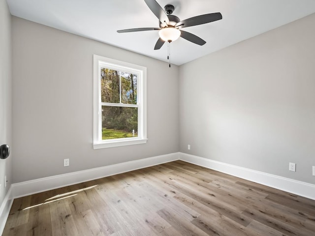 17 Broken Bow Trl, Crawfordville, FL 32327 - empty room featuring a ceiling fan, wood finished floors, and baseboards